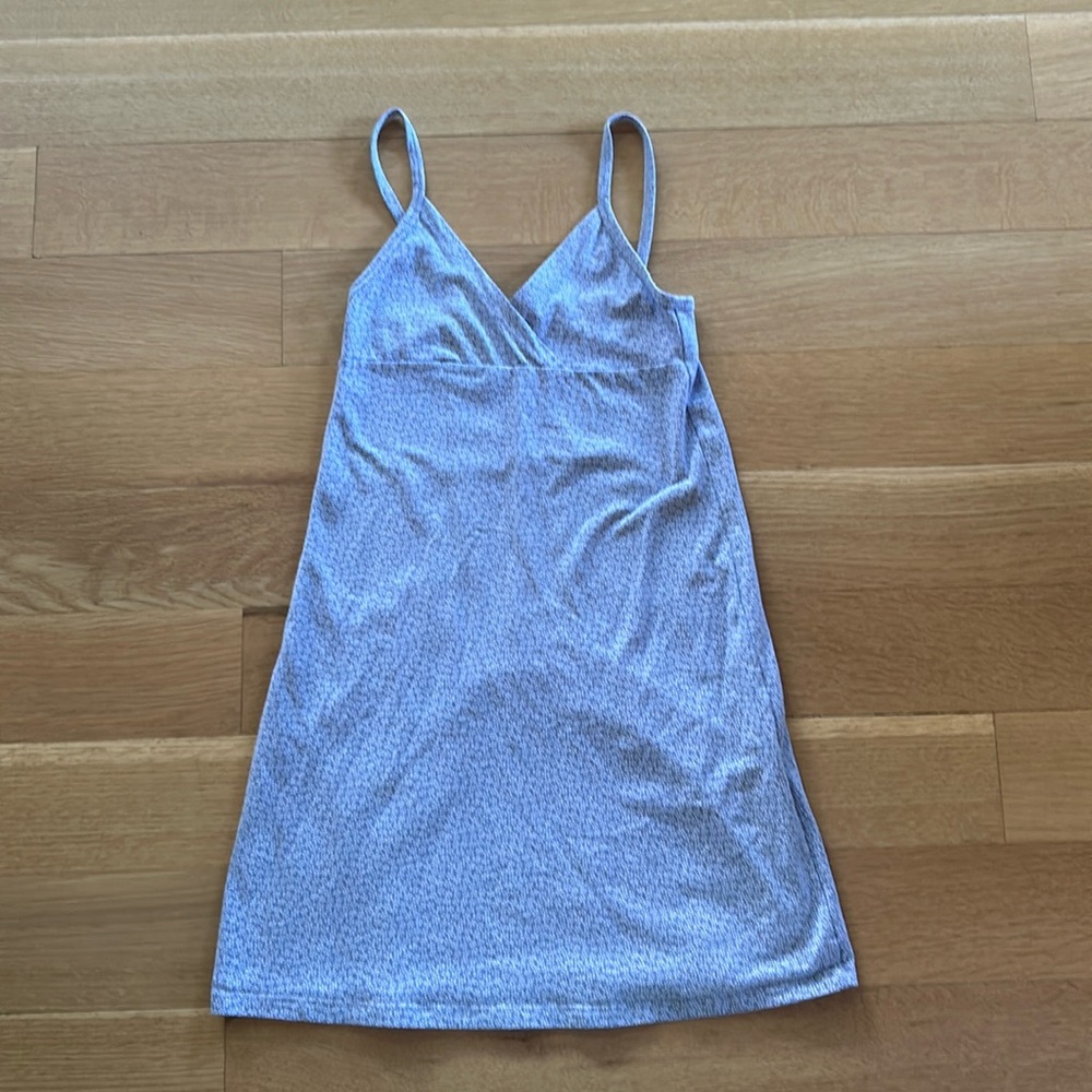 BRANDY MELVILLE periwinkle mini dress with white flower pattern.